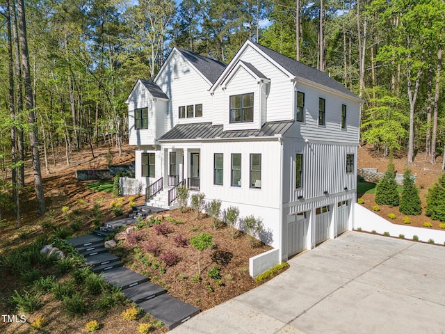 modern inspired farmhouse featuring a garage