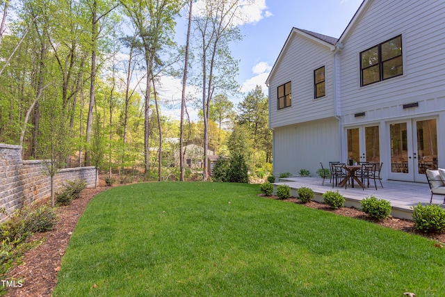 view of yard featuring french doors