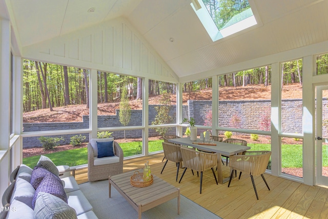 sunroom with a healthy amount of sunlight and lofted ceiling with skylight