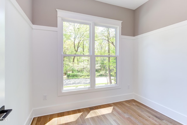 spare room with light wood-type flooring