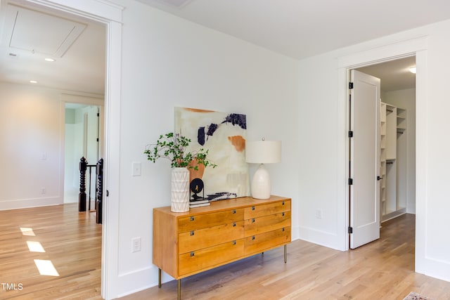 corridor with light hardwood / wood-style flooring