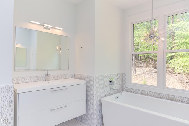 bathroom with vanity and a bath