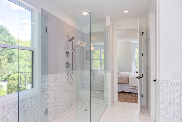 bathroom featuring an enclosed shower and tile patterned flooring