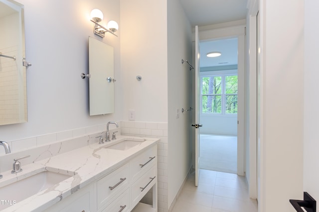 bathroom with tile patterned floors and vanity