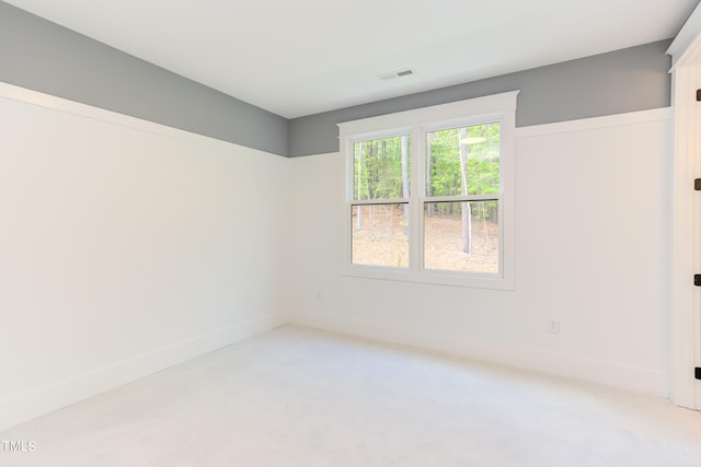 spare room featuring carpet flooring