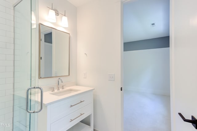 bathroom with walk in shower and vanity