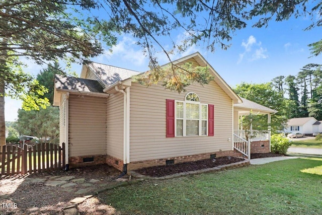 view of property exterior with a lawn