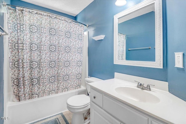 full bathroom with shower / bath combo with shower curtain, vanity, a textured ceiling, and toilet