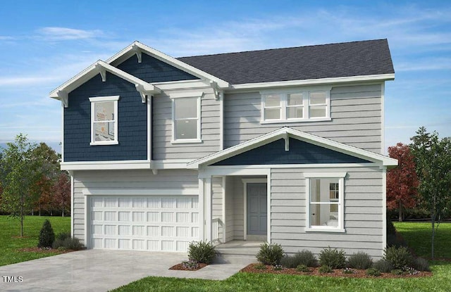 view of front of home featuring a garage and a front lawn