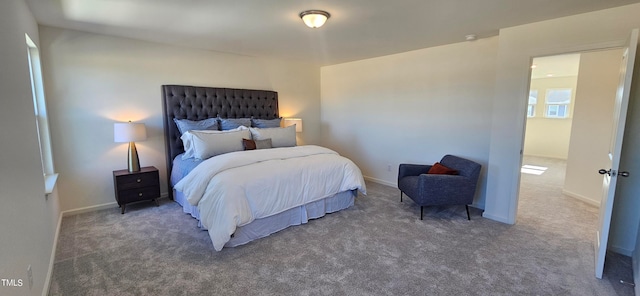 bedroom featuring dark carpet