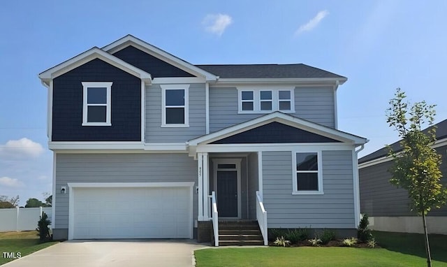 view of front facade featuring a front lawn and a garage