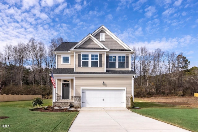 craftsman-style home featuring a garage and a front yard