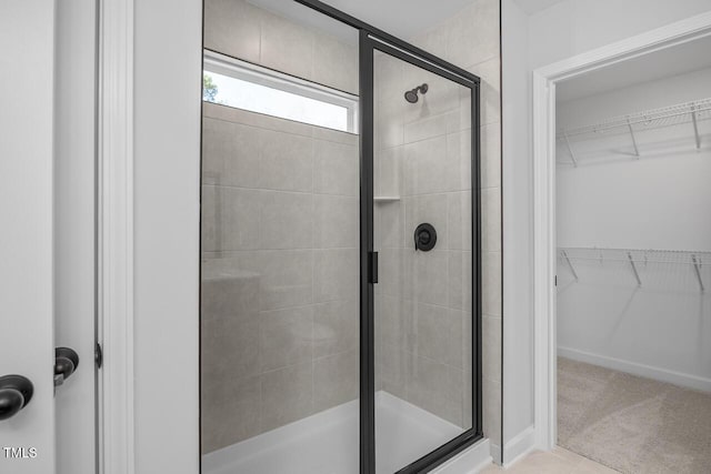 bathroom with a shower with shower door