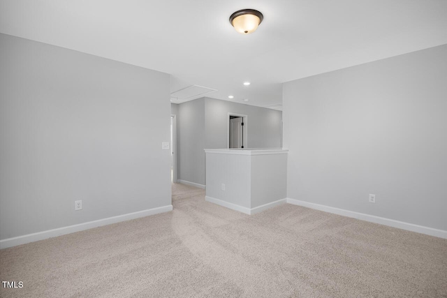 unfurnished room with light carpet