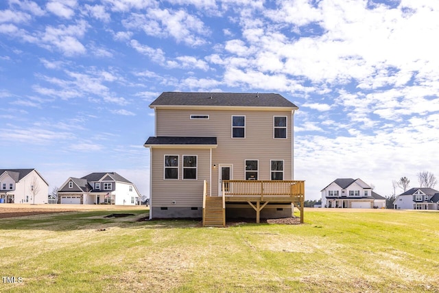 back of house with a wooden deck and a lawn