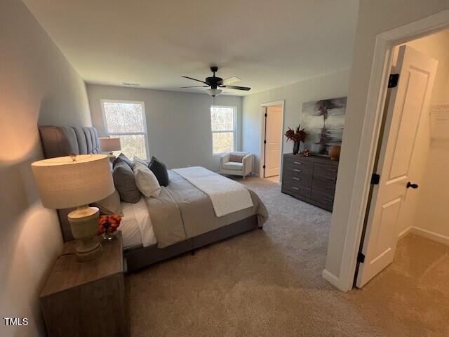 carpeted bedroom featuring ceiling fan