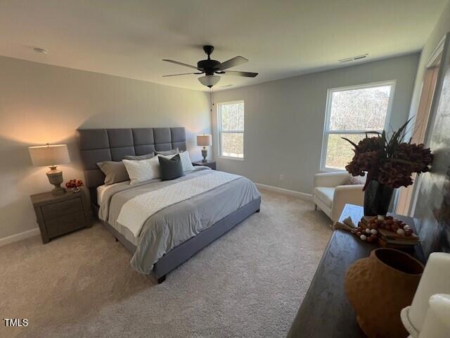 carpeted bedroom featuring ceiling fan