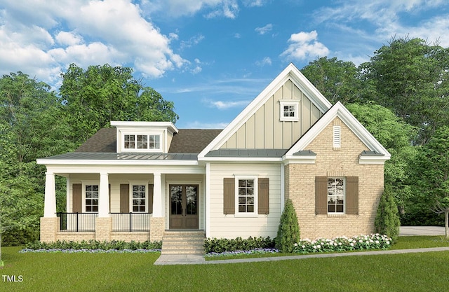 craftsman house with covered porch and a front yard