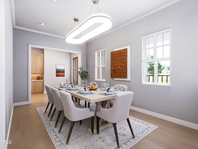 dining space featuring crown molding and light hardwood / wood-style flooring