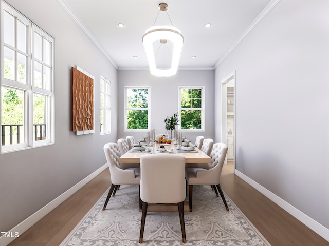 dining space with light wood-type flooring and ornamental molding