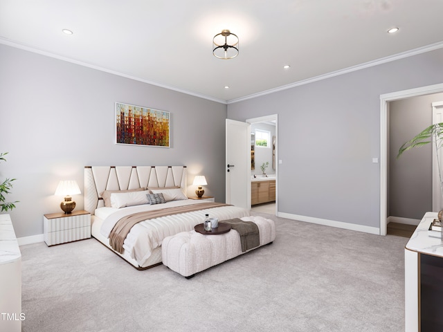 bedroom featuring crown molding, light carpet, and connected bathroom