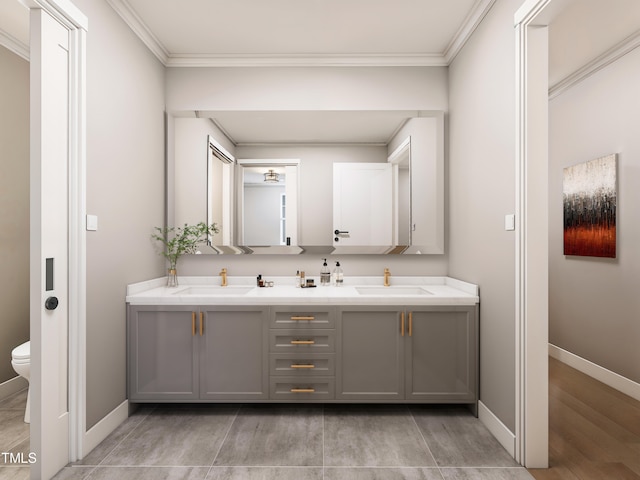 bathroom with crown molding, vanity, toilet, and wood-type flooring