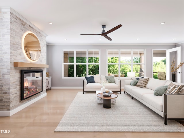 living room with ceiling fan, a multi sided fireplace, crown molding, and light hardwood / wood-style flooring