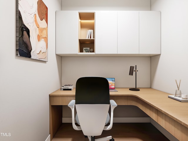 office area with built in desk and wood-type flooring