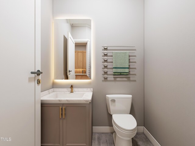 bathroom with vanity and toilet