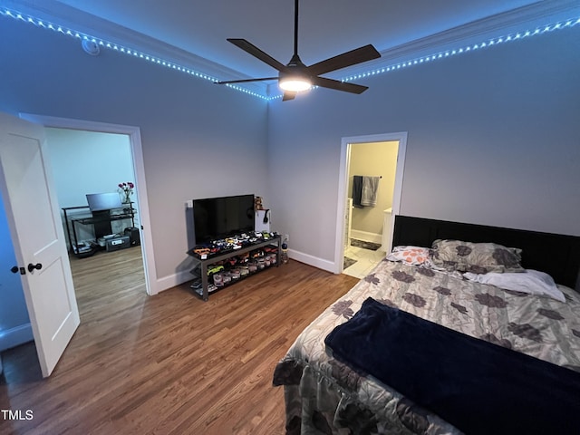 223 E Nash St, Spring Hope, NC 27882 - bedroom with ensuite bathroom, baseboards, ceiling fan, and wood finished floors