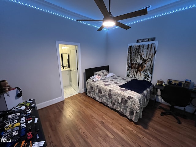 223 E Nash St, Spring Hope, NC 27882 - bedroom featuring ensuite bathroom, ceiling fan, wood finished floors, and baseboards