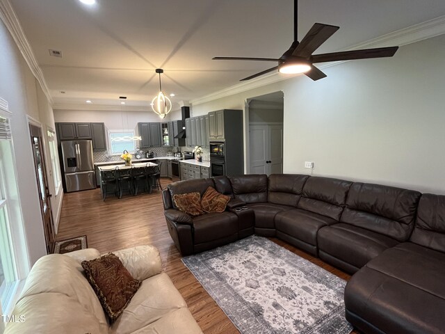 223 E Nash St, Spring Hope, NC 27882 - living area with visible vents, ceiling fan, crown molding, recessed lighting, and wood finished floors