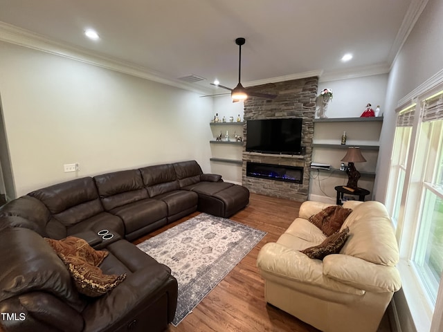 223 E Nash St, Spring Hope, NC 27882 - living area with crown molding, wood finished floors, a fireplace, and recessed lighting