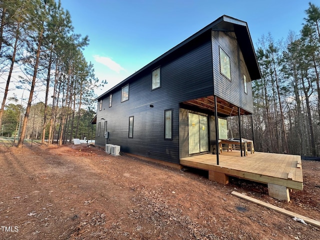 view of property exterior with a deck