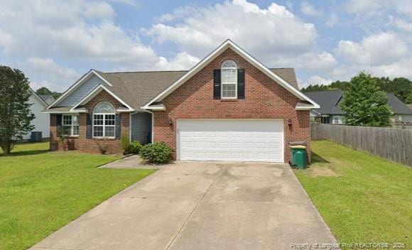 view of front facade featuring a front yard and a garage