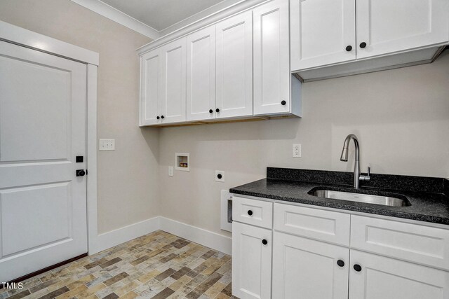 laundry area featuring hookup for a washing machine, electric dryer hookup, cabinets, ornamental molding, and sink