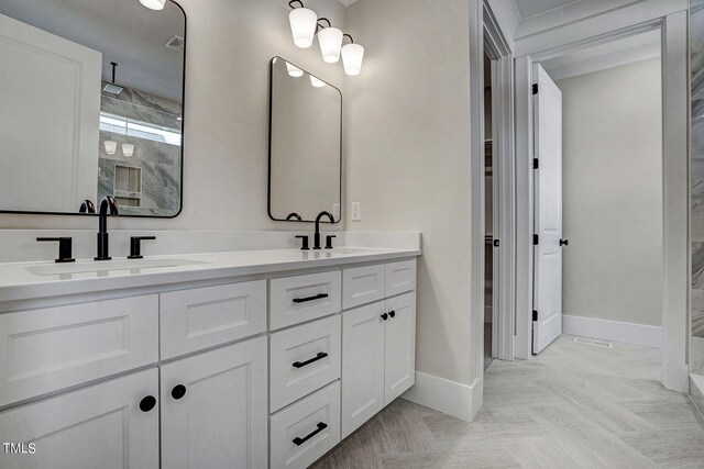 bathroom with walk in shower and vanity