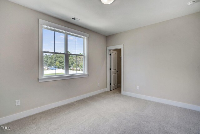 spare room featuring carpet flooring