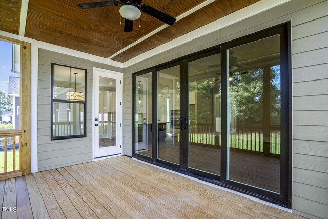 wooden deck with ceiling fan