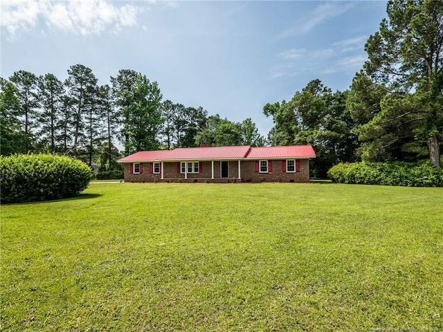 ranch-style home with a front lawn