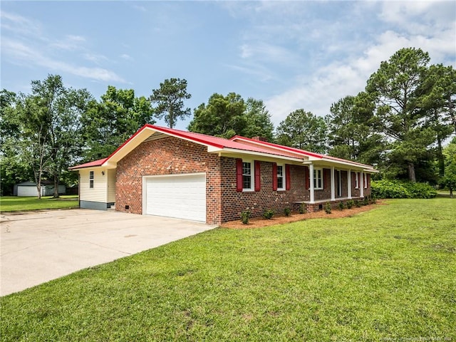 ranch-style house featuring a garage and a front lawn