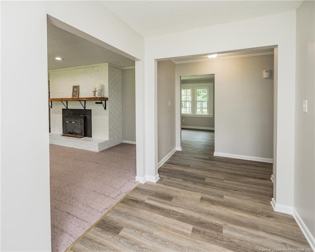 hall with hardwood / wood-style floors