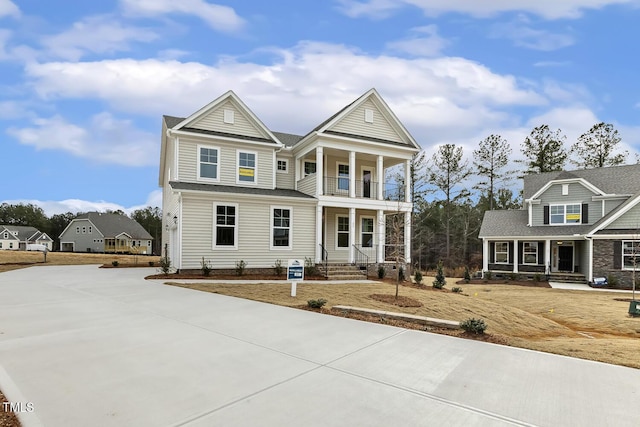 view of front of property featuring a balcony