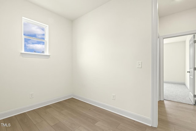 spare room with light wood-type flooring