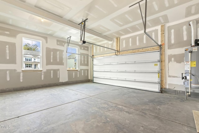 garage featuring a garage door opener and gas water heater