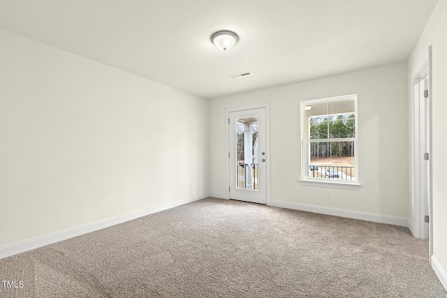 spare room featuring carpet flooring