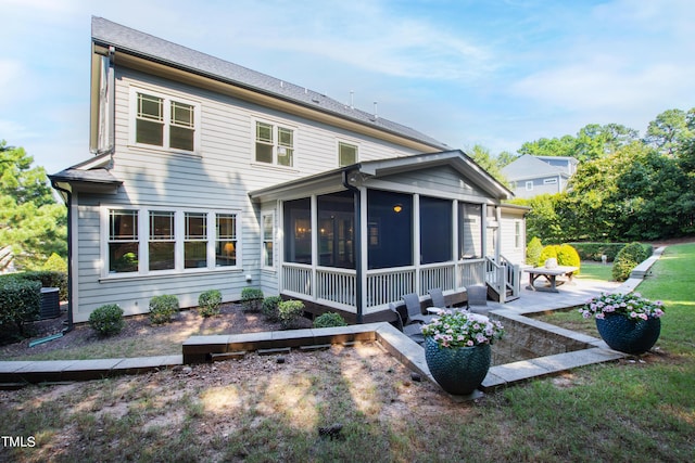3209 Bryant Falls Ct, Raleigh, NC 27613 - rear view of house featuring a sunroom