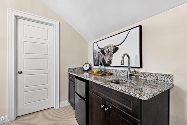 3209 Bryant Falls Ct, Raleigh, NC 27613 - bar with a sink, light carpet, lofted ceiling, and baseboards