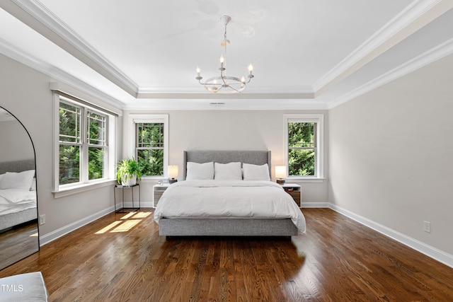 3209 Bryant Falls Ct, Raleigh, NC 27613 - bedroom with a chandelier, a tray ceiling, wood finished floors, baseboards, and ornamental molding