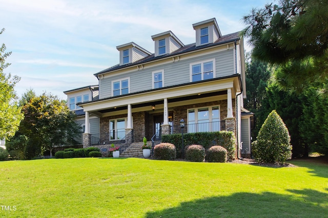 3209 Bryant Falls Ct, Raleigh, NC 27613 - traditional style home with covered porch, a front yard, and stone siding